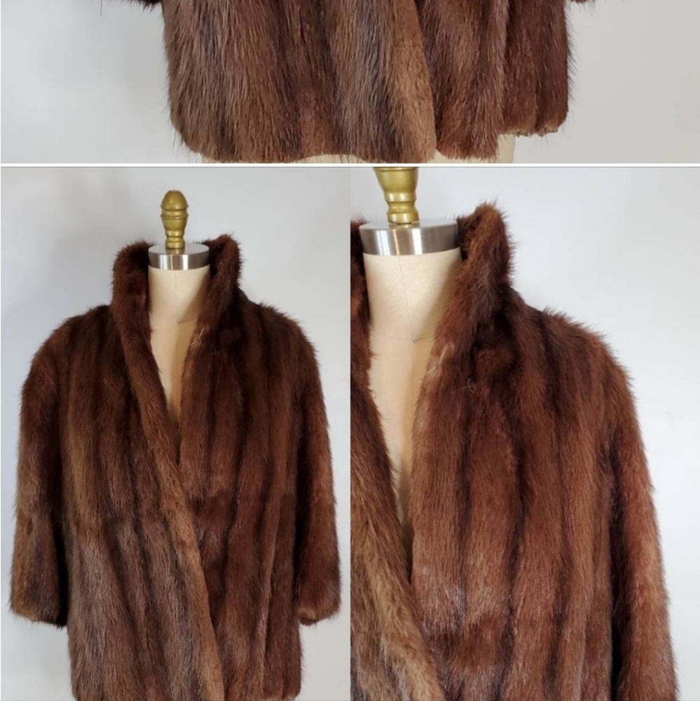 Mink coat size L with 3/4 length sleeves.